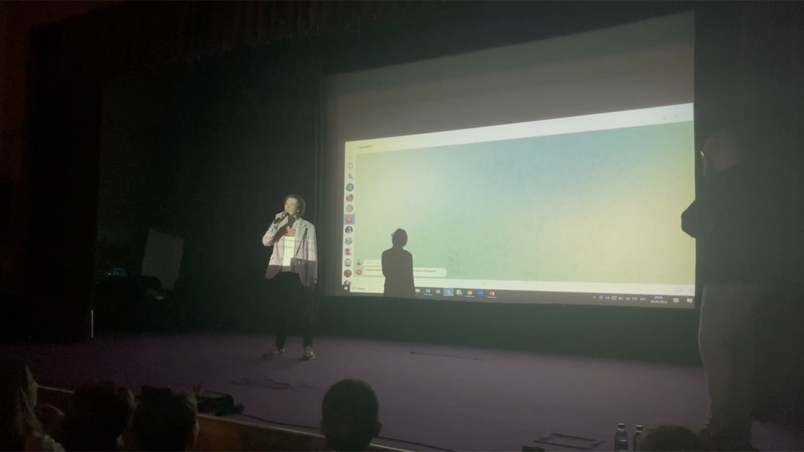 Boris Khesin on stage with a microphone, presenting the fine-tuned model to an audience, June 2023.
